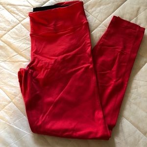 90 Degree, coral-reddish running pants.